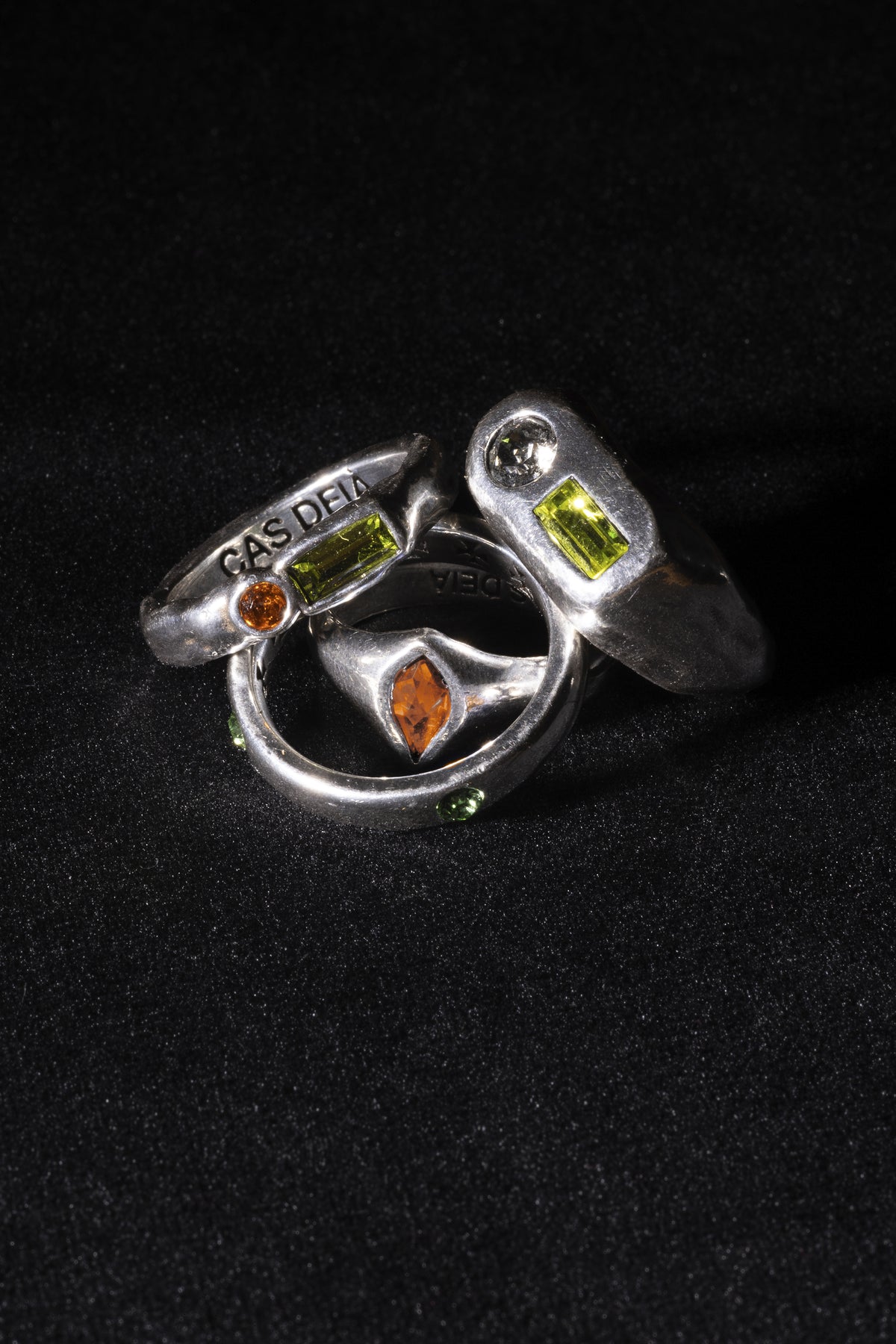 CAS DEIÀ GOTA RING SUNSET ORANGE with other CAS DEIÀ rings, silver finish