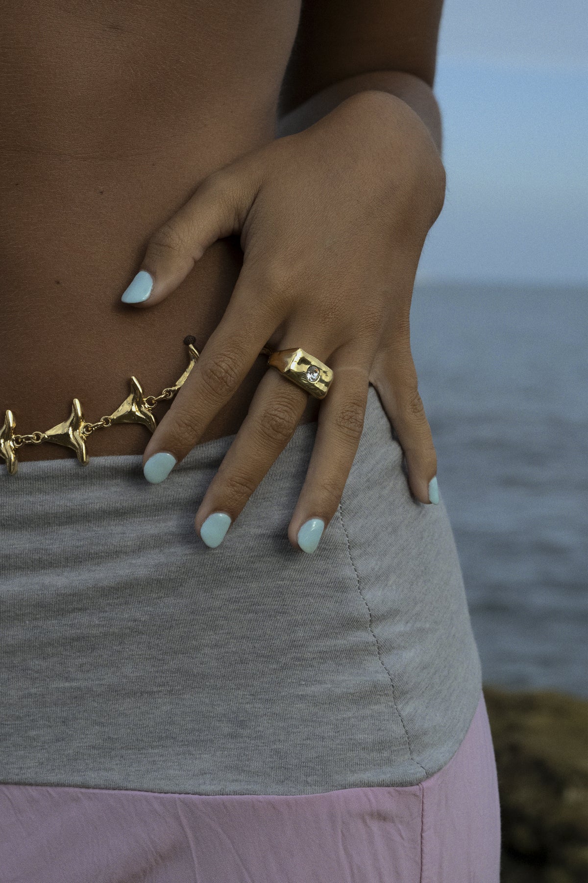 CAS DEIÀ ROCA RING CLEAR CRYSTAL worn on the hand, gold finish