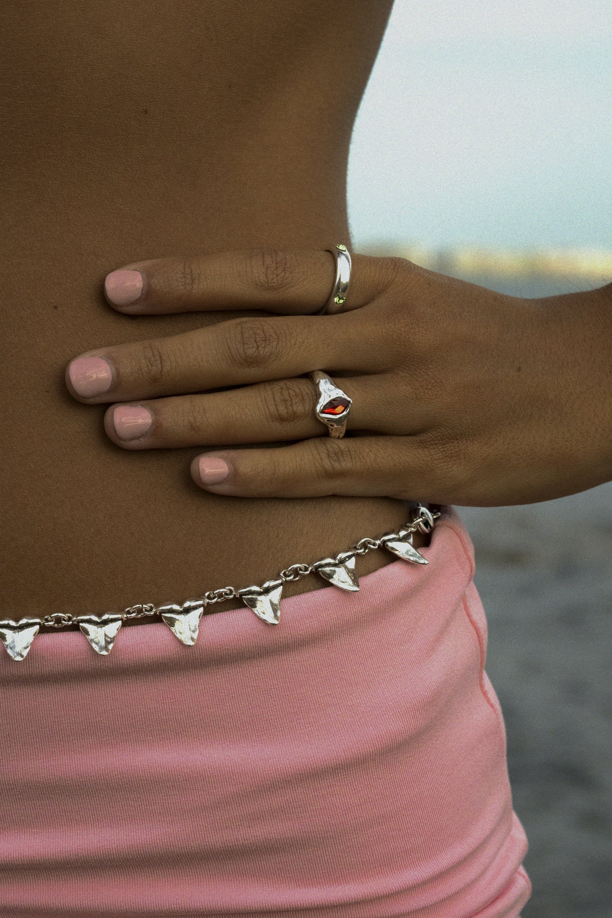 CAS DEIÀ GOTA RING RED worn on the hand, silver finish