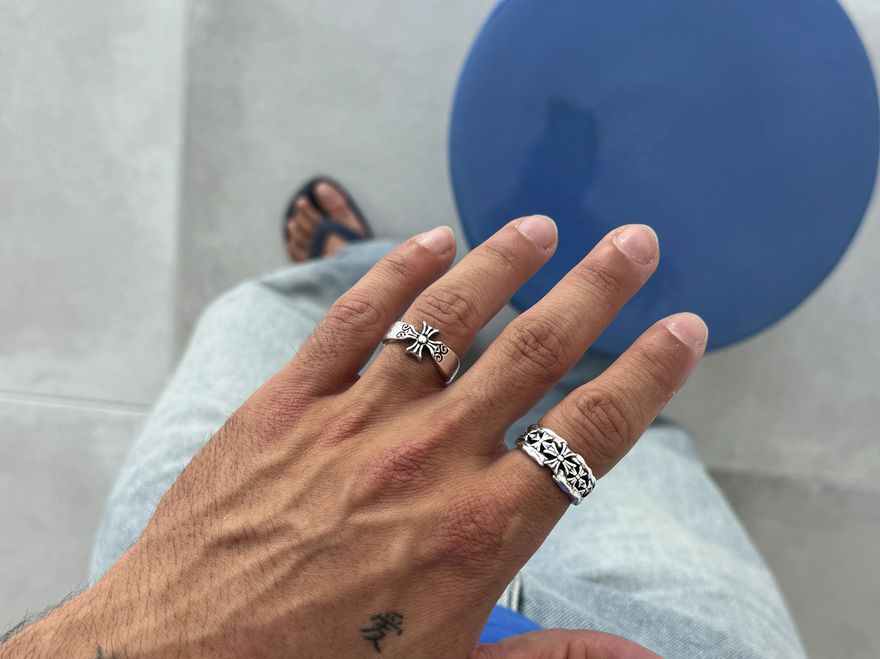Hand with stacked silver rings
